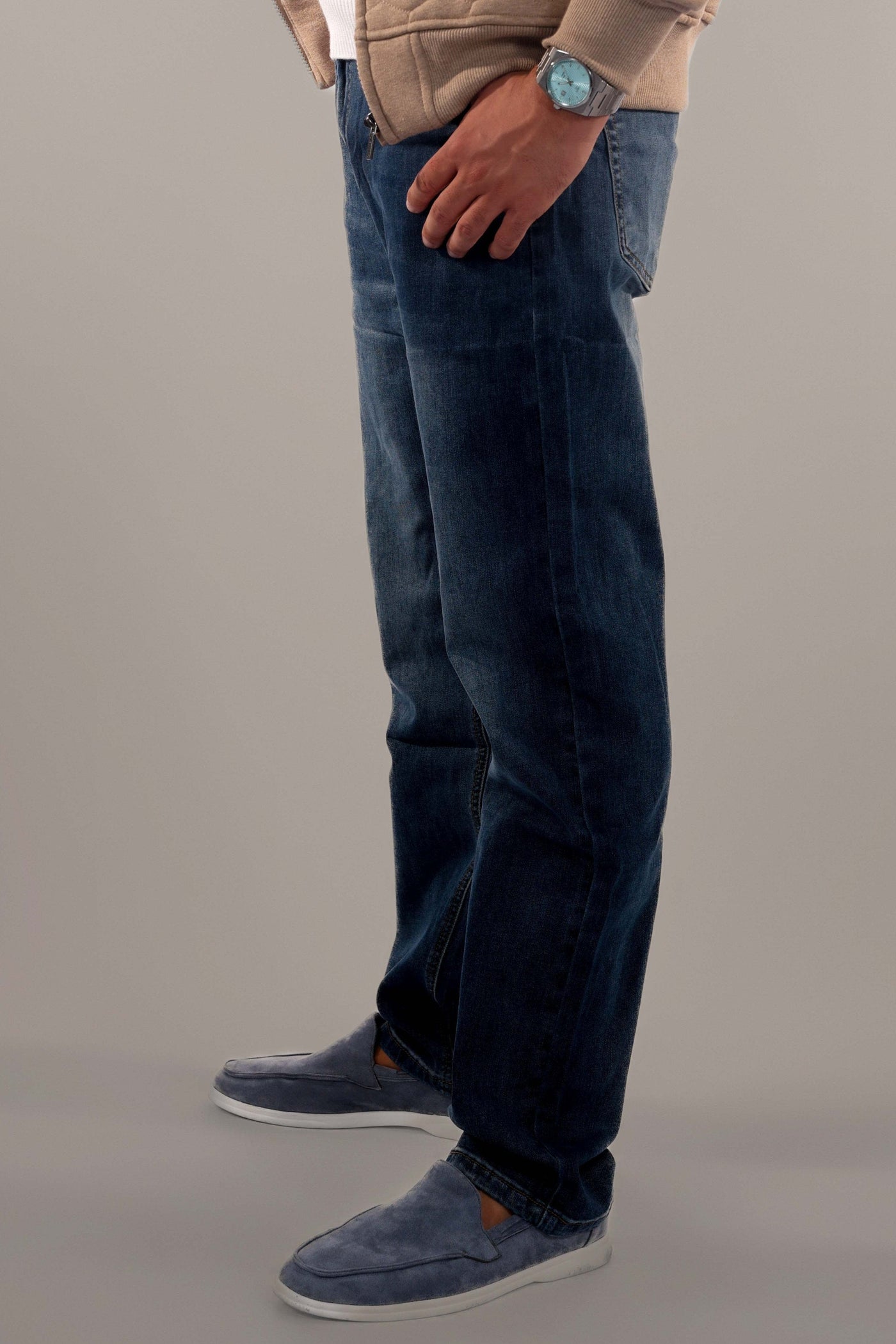 Men-model-wears-dark-blue-jeans-standing-in-side-view-modern-and-casual-design