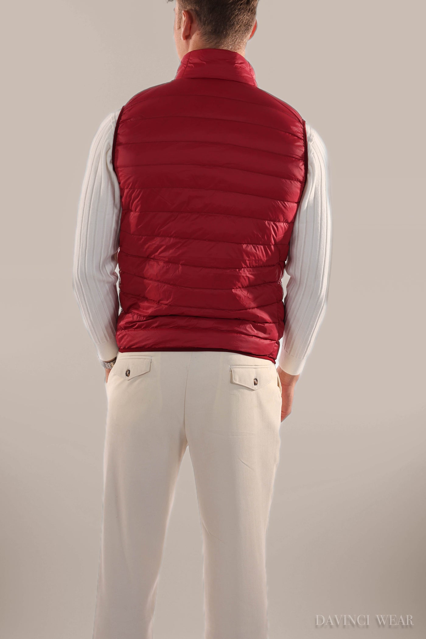 Men's-red-leather-bomber-jacket-model-standing-in-side-profile-elegant-design
