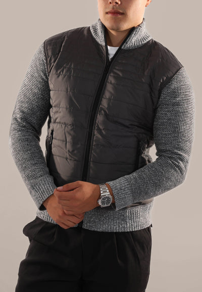 Men's-model-wears-grey-leather-jacket-stands-out-in-front-modern-and-marked-design