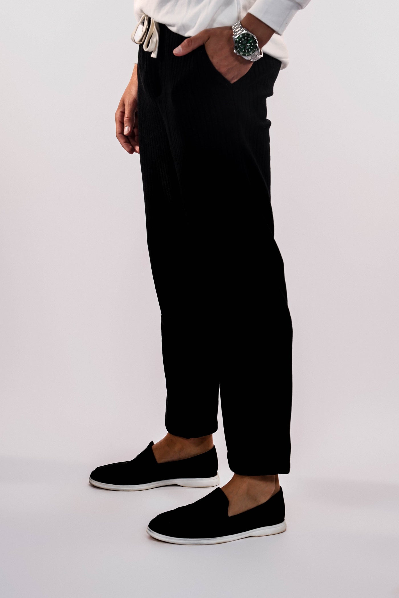 Men's-model-wears-black-freedom-pants-stands-front-hand-in-the-pocket-view-casual-and-comfortable-design