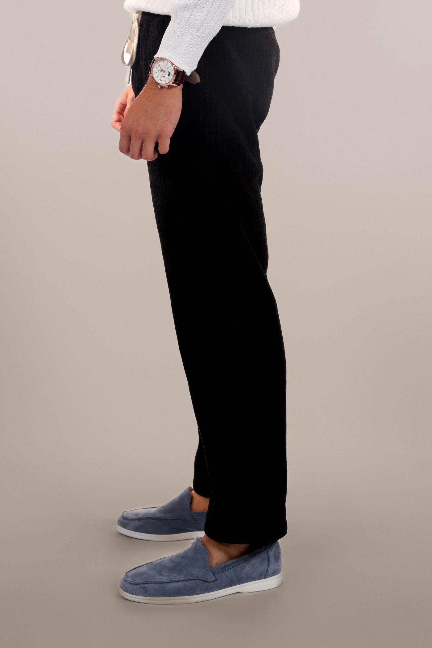 Men-model-wears-black-freedom-pants-standing-in-side-view-casual-and-comfortable-design