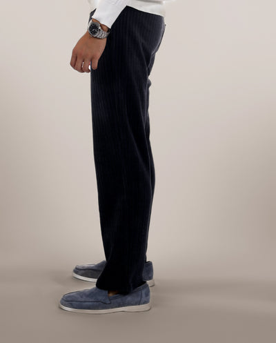 Men-model-wears-navy-blue-freedom-pants-standing-in-the-side-view-casual-and-comfortable-design