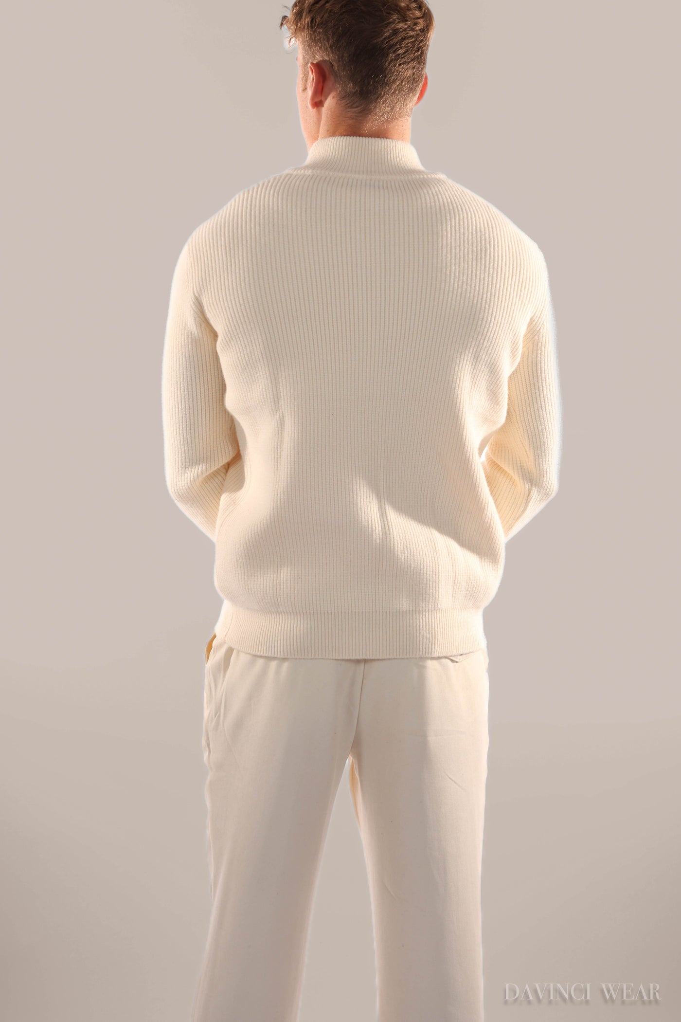 Men's-model-wears-bend-colored-knit-sweater-back-view-with-zipper-elegant-and-cozy-design