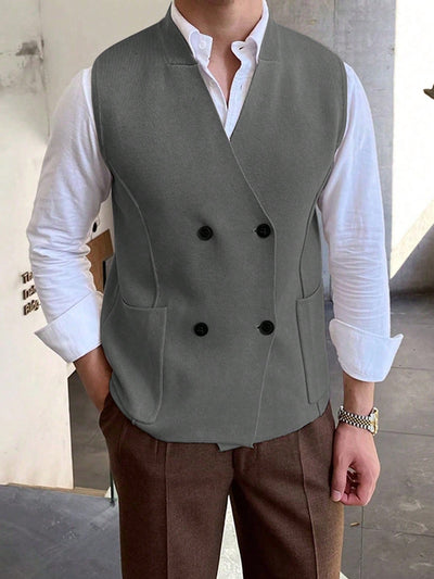 Men's-grey-double-sided-vest-with-white-shirt-collar-detail-and-brown-trousers