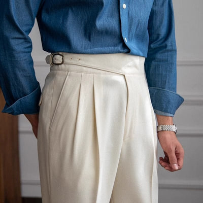 The-male-model-wears-cream-colored-pants-with-a-high-waistband-elegant-and-classic-design