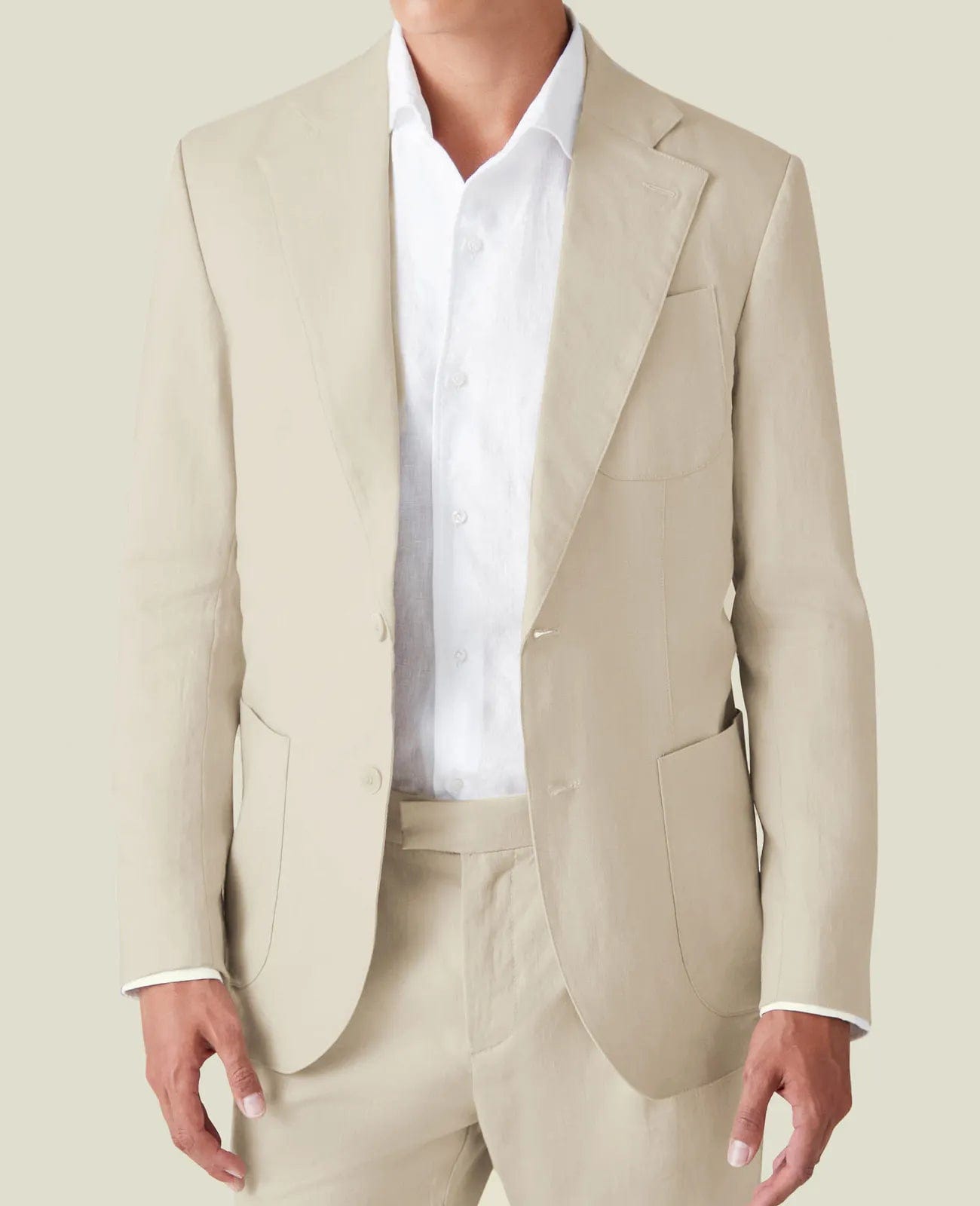 Men's-beige-tailored-linen-suit-with-classic-white-shirt-collar-detailing