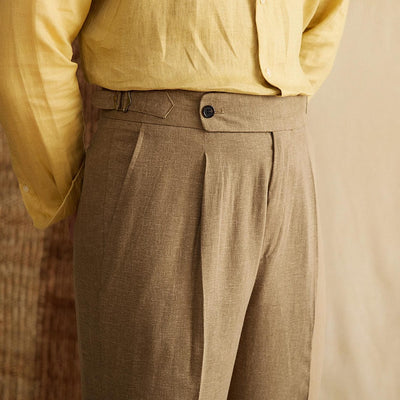 Men's-high-waisted-trousers-in-lightweight-fabric-in-brown-with-elegant-pleated-seam-and-yellow-shirt