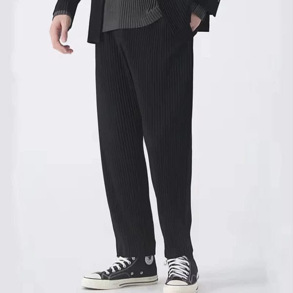 Men's black ribbed trousers with a loose fit and modern silhouette - elegantly styled.