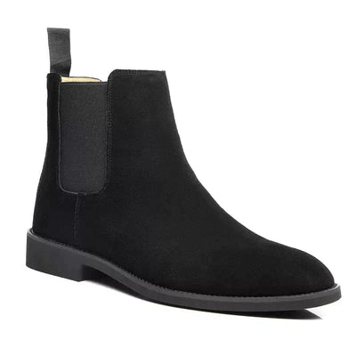 Bottes de Chelsea en daim noir avec semelle claire et empiècements élastiques, design élégant et intemporel